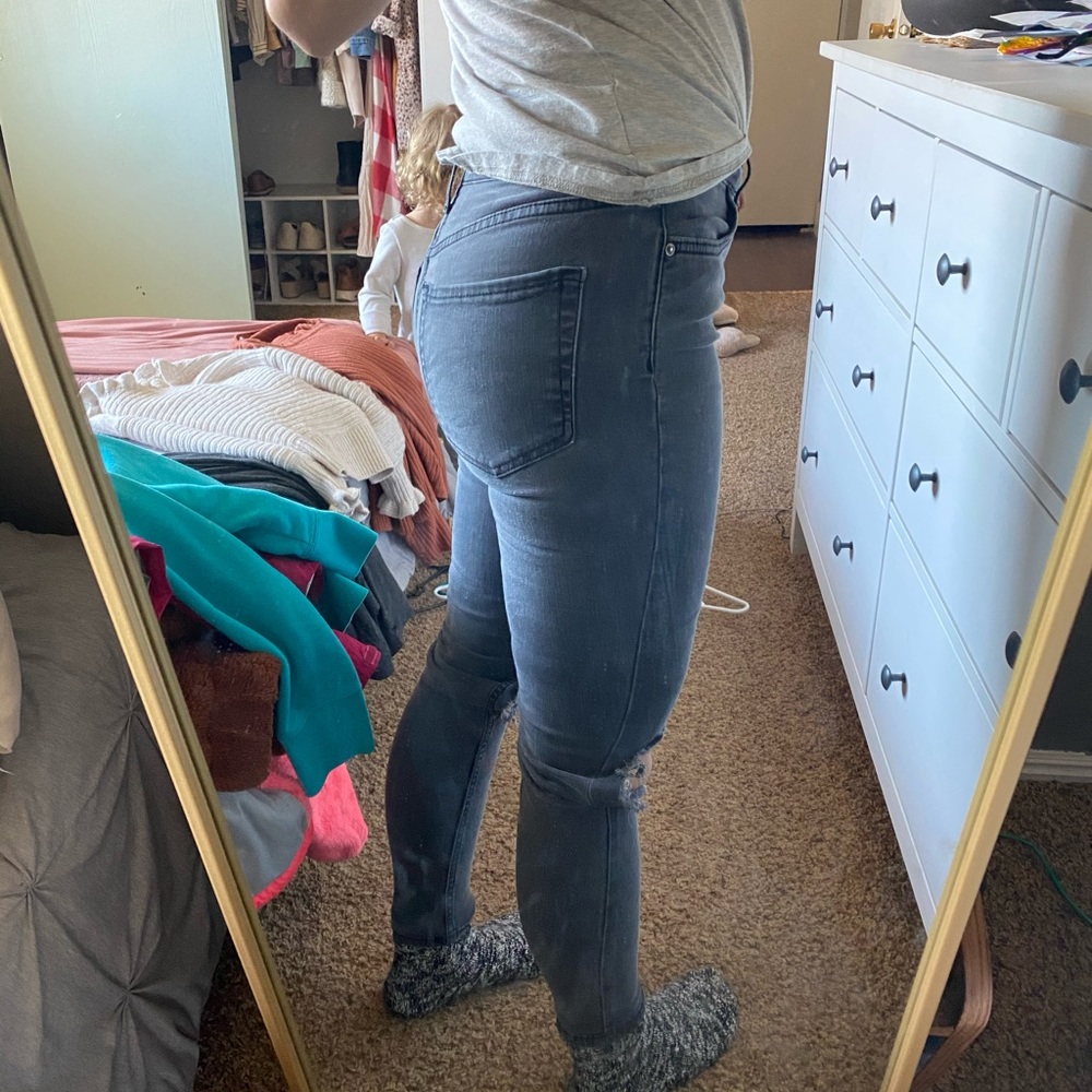 Free people “washed black” jeans with holes in knee. Size 26. Great condition.